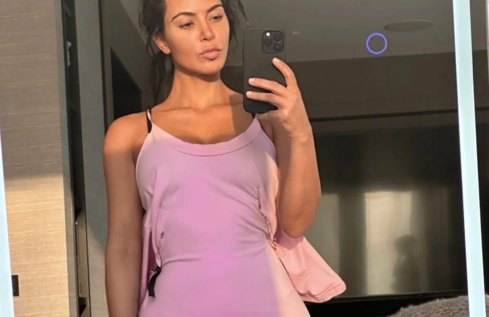 Kim Kardashian has been spooked by a figure in the background of a selfie she snapped while apparently home alone credit:Bang Showbiz