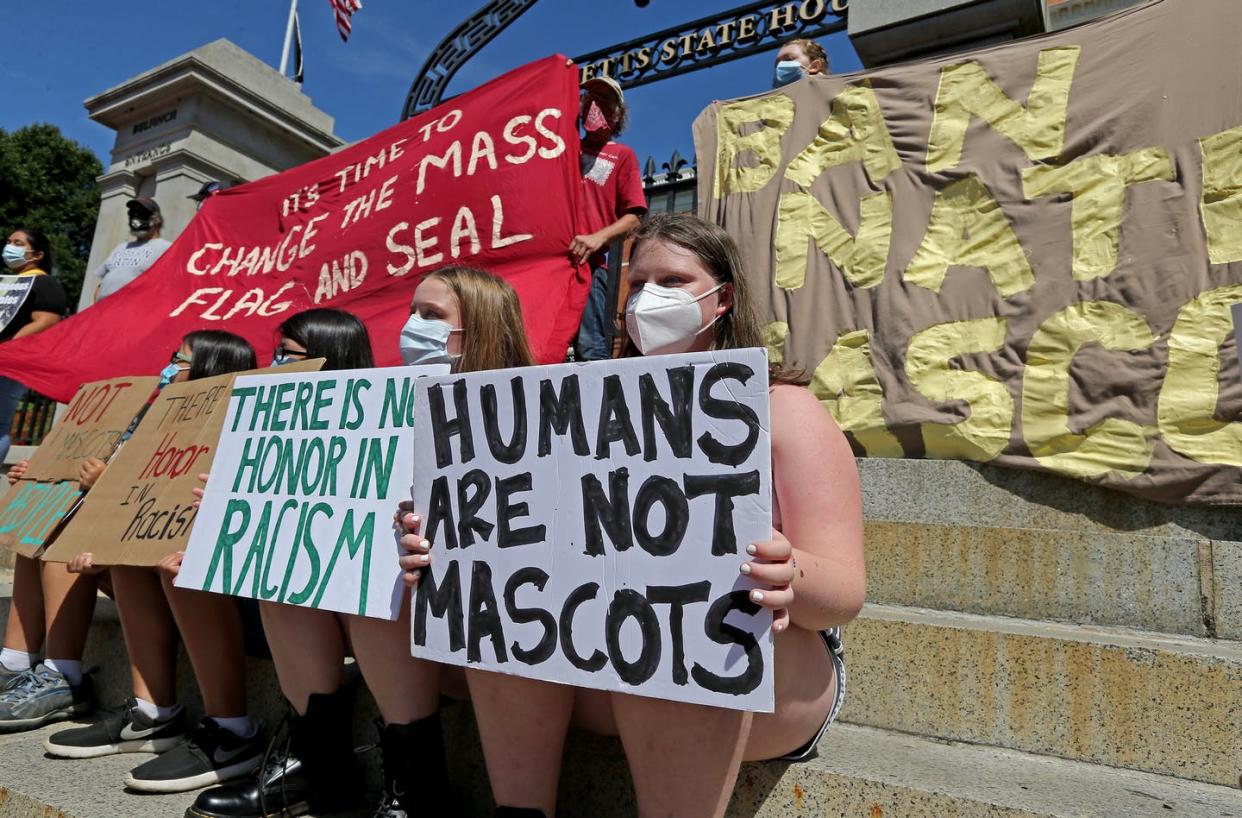 <span class="caption">Change the Flag supporters protest on the steps of the statehouse on July 16, 2020 in Boston.</span> <span class="attribution"><a class="link " href="https://www.gettyimages.com/detail/news-photo/people-that-want-the-state-flag-changed-gather-on-the-steps-news-photo/1257558862?adppopup=true" rel="nofollow noopener" target="_blank" data-ylk="slk:Stuart Cahill/MediaNews Group/Boston Herald via Getty Images;elm:context_link;itc:0;sec:content-canvas">Stuart Cahill/MediaNews Group/Boston Herald via Getty Images</a></span>