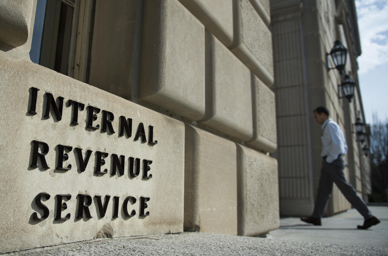 A man walks into the Internal Revenue Service building in Washington, DC. (Credit: Andrew Caballero-Reynolds, Getty Images)