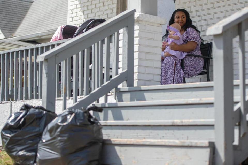 Taylynne Ivie leaves two trash bags out on the front porch of her home on Tuesday, April 4, 2023, in Kansas City. Ivie is one of the many residents across the metro who have experienced challenges with the city’s two bag trash limit.