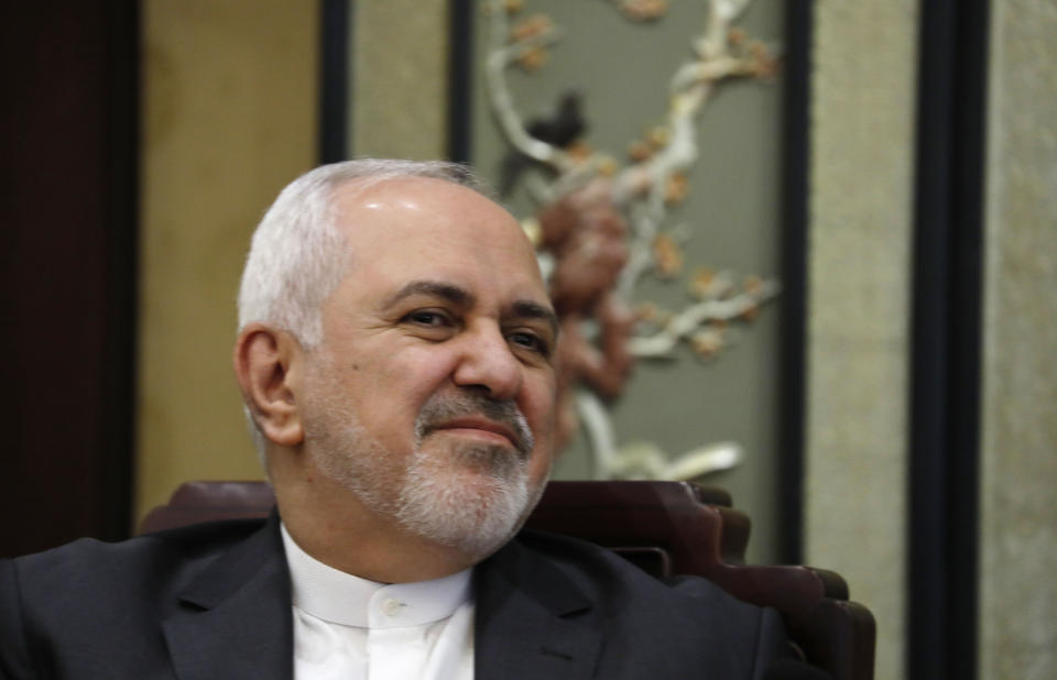 Iranian Foreign Minister Mohammad Javad Zarif, left, and his Chinese counterpart Wang Yi, talk during their meeting at the Diaoyutai State Guesthouse in Beijing, China, Tuesday, Feb. 19, 2019. The foreign ministers of China and Iran met in Beijing on Tuesday amid efforts to preserve the 2015 nuclear deal with Tehran.(How Hwee Young/Pool Photo via AP)