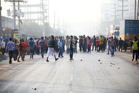 Garment workers block a road as they protest for higher wages at Ashulia, outskirt of Dhaka, Bangladesh, January 14, 2019. REUTERS/Mohammad Ponir Hossain