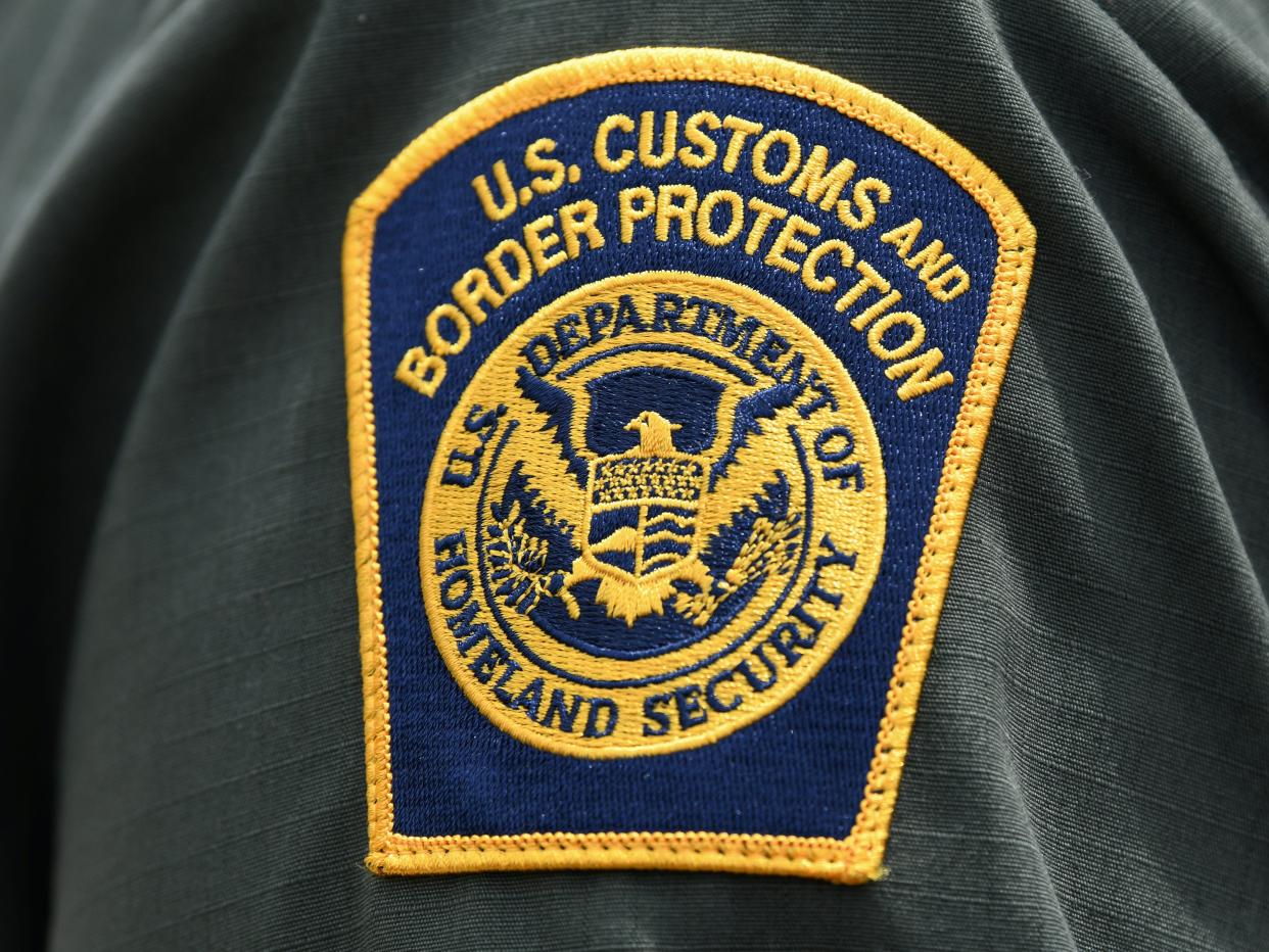 FILE PHOTO: A U.S. Customs and Border Protection patch is seen on the arm of a U.S. Border Patrol agent in Mission, Texas, U.S., July 1, 2019.  REUTERS/Loren Elliott