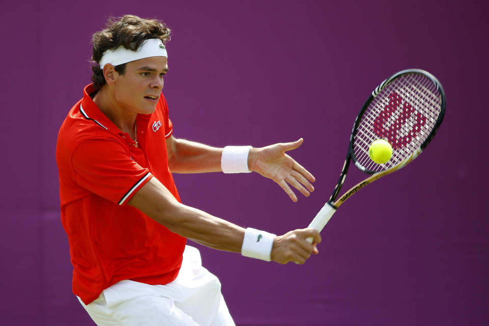 Milos Raonic of Canada plays a backhand during the Men's Singles Tennis match against Tatsuma Ito of Japan on Day 3 of the London 2012 Olympic Games at the All England Lawn Tennis and Croquet Club in Wimbledon on July 30, 2012 in London, England. (Getty Images)