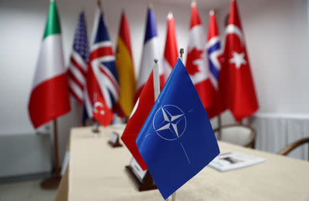 A NATO flag and the flags of participating countries are pictured during the Dynamic Monarch-17, a NATO-sponsored submarine escape and rescue exercise, at the Turkish Naval base of Aksaz, Turkey, September 20, 2017. REUTERS/Murad Sezer