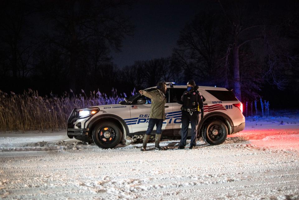 Antonio Cosme speaks to an officer on Feb. 18, 2022.