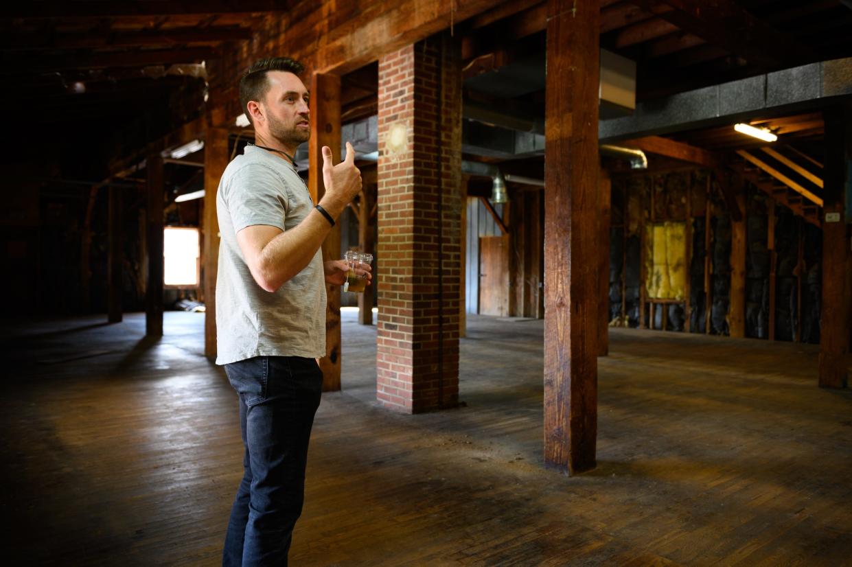 Bryan Beal, founder of B&B Investment Partners, gives a tour of an old flour mill he hopes to redevelop in Fountain Inn Tuesday, Nov. 2, 2021.