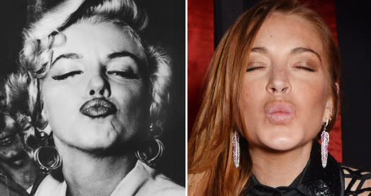 Monroe and Lohan pucker up. (Getty Images)