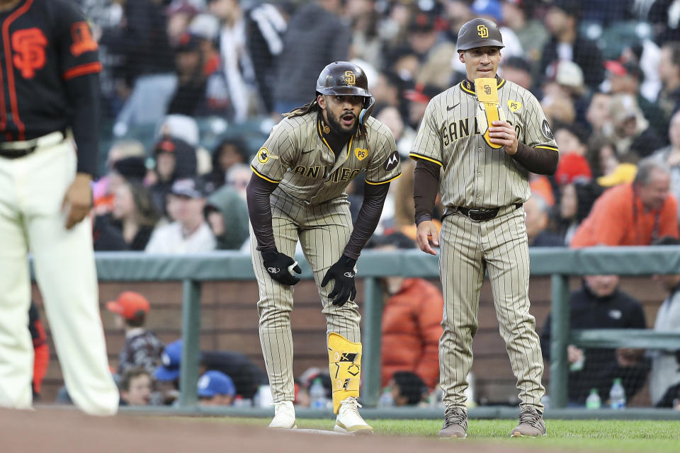 San Diego Padres' Fernando Tatis Jr., center, reacts to a play against the San Francisco Giants in the third inning of a baseball game in San Francisco, Saturday, April 6, 2024. (AP Photo/Kavin Mistry)