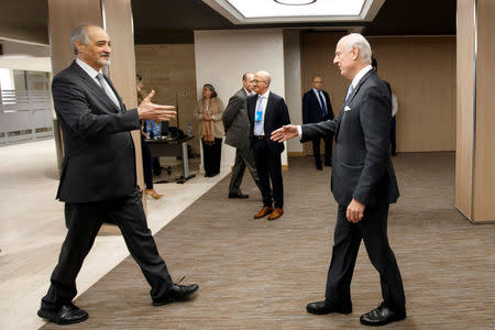 Bashar al-Jaafari (L), Syrian chief negotiator and Ambassador of the Permanent Representative Mission of the Syria to UN New York, shakes hands with UN Special Envoy of the Secretary-General for Syria Staffan de Mistura, right, prior a round of negotiation, during the Intra Syria talks, at the European headquarters of the United Nations in Geneva, Switzerland March 3, 2017. REUTERS/Salvatore Di Nolfi/Pool