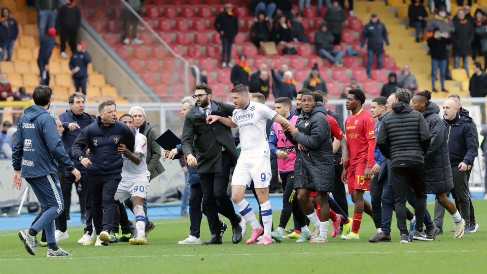 D'Aversa and Verona's Thomas Henry (in white, No. 9) got into a heated scuffle after the match. - Donato Fasano/Getty Images