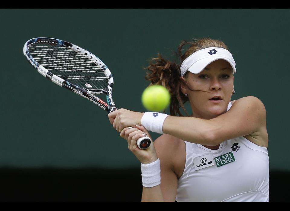 Agnieszka Radwanska of Poland plays a shot to Angelique Kerber of Germany during a semifinals match at the All England Lawn Tennis Championships at Wimbledon, England, Thursday, July 5, 2012.