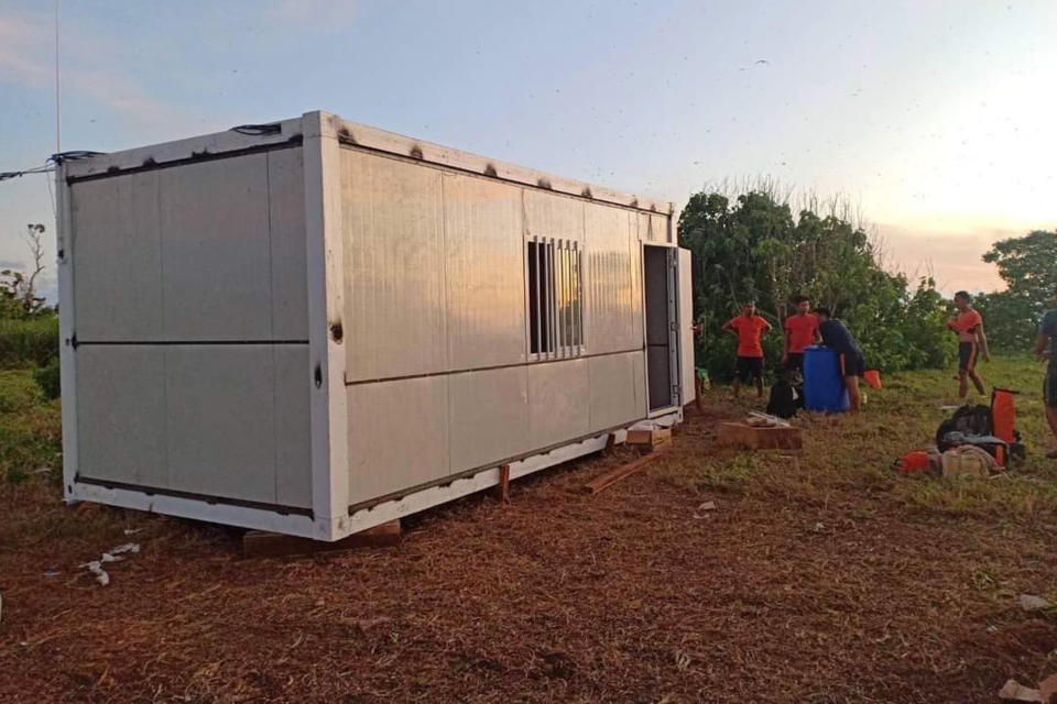 In this photo provided by the Philippine Coast Guard, Coast Guard members construct an outpost at an island in the disputed South China Sea on May 17, 2022. The Philippines has established three coast guard outposts on three islands in the disputed South China Sea to monitor ship movements and promote safety, coast guard officials said Friday, amid increasing maritime tensions with China. (Philippine Coast Guard via AP)