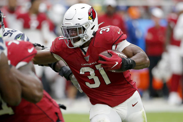 Arizona Cardinals running back David Johnson (31) wears custom cleats prior  to an NFL football game against the Pittsburgh Steelers, Sunday, Dec. 8,  2019, in Glendale, Ariz. (AP Photo/Ross D. Franklin Stock