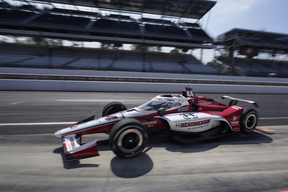 Katherine Legge, of England, pulls into the pits during practice for the Indianapolis 500 auto race at Indianapolis Motor Speedway, Thursday, May 25, 2023, in Indianapolis. (AP Photo/Darron Cummings)