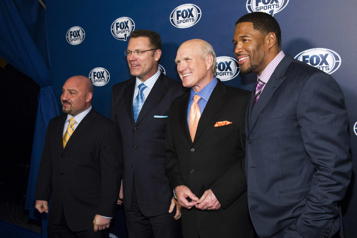 FILE - This March 5, 2013, file photo shows Jay Glazer, from left, Howie Long, Terry Bradshaw and Michael Strahan attending the Fox Sports Media Upfront party celebrating the new Fox Sports 1 network in New York. Bradshaw thought his career as a football analyst was over in 1993 when CBS lost the NFL rights to Fox. Instead of going back to cattle ranching, he has had a front-row seat to the biggest sports broadcasting story of the past quarter century.  (Photo by Charles Sykes/Invision/AP, File)