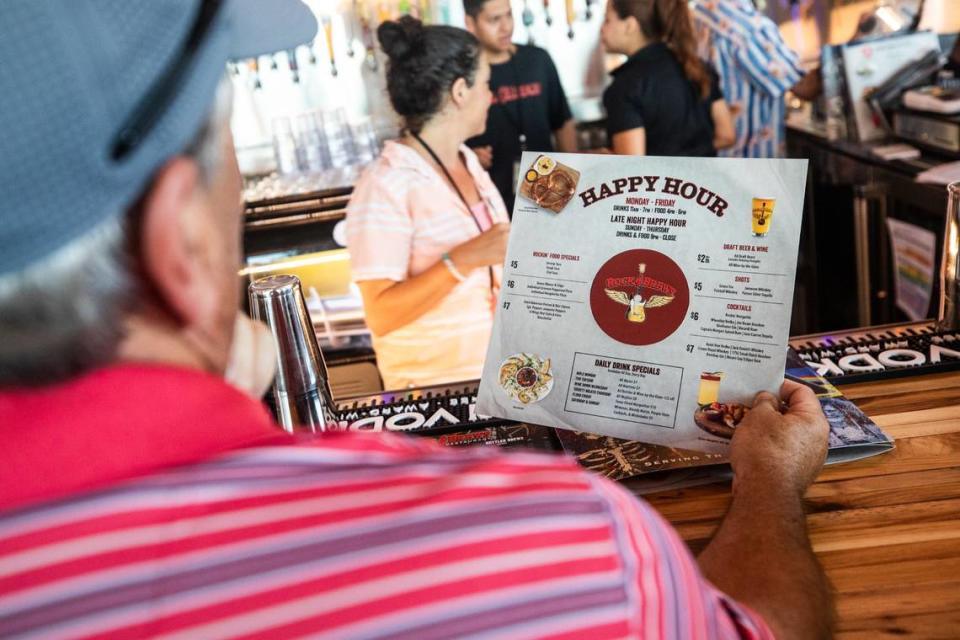 George Chabot browses the drink menu on Tuesday, July 2, 2024, at Rock & Brews in Grapevine. Charbot said he was excited to check out the new bar.