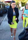 Celebrities in neon fashion: Kim Kardashian wore this neon outfit in LA - as did her fan!<br><br>[Rex]