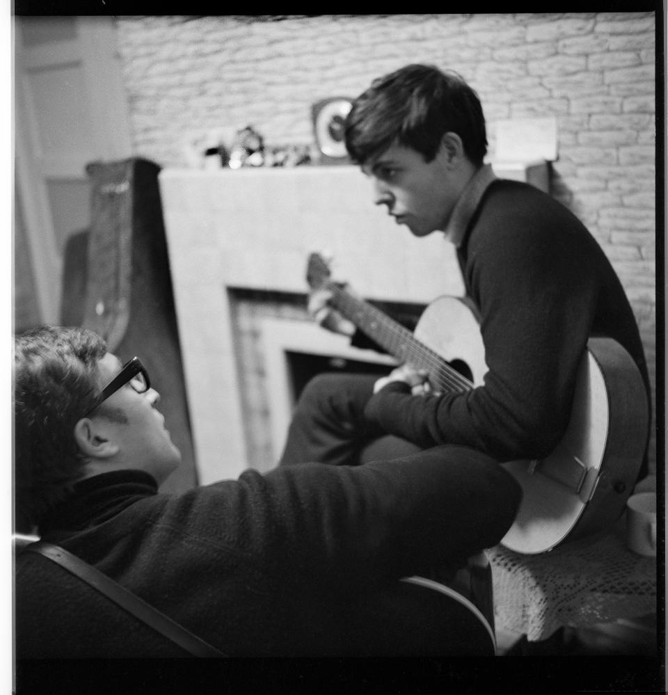 John Lennon and Sir Paul writing at 20 Forthlin Road in 1962 (Mike McCartney/Courtesy of Genesis PublicationsPA)