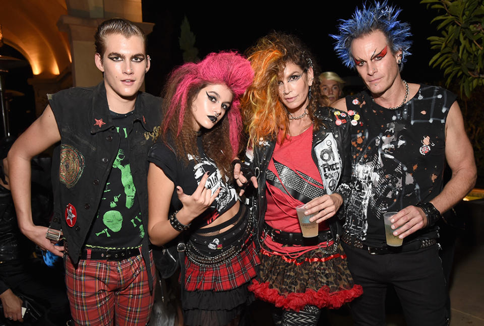 <p>The supermodel and her Casamigos co-founder husband Rande Gerber (along with their kids, Presley and Kaia) went punk for the tequila brand’s Halloween bash in Beverly Hills. (Photo: Michael Kovac/Getty Images) </p>