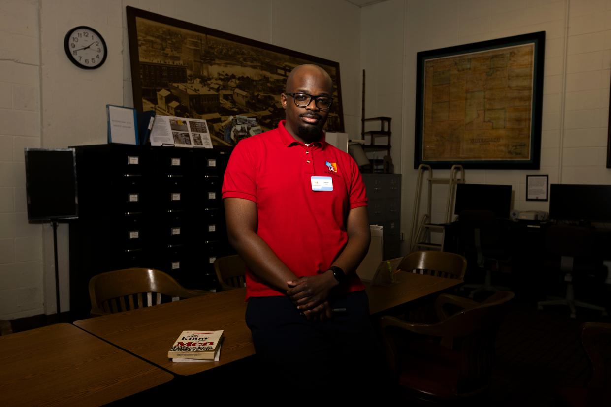 Librarian Jawuan Walters poses for a portrait Tuesday, Feb. 6, 2024, in the local history room of the Hart Interim Library in downtown Rockford.