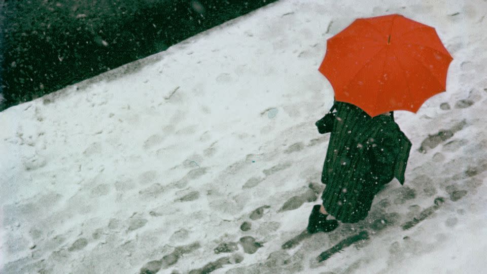 Leiter's iconic image "Footprints," taken around 1950. His work often featured umbrellas. - Saul Leiter Foundation