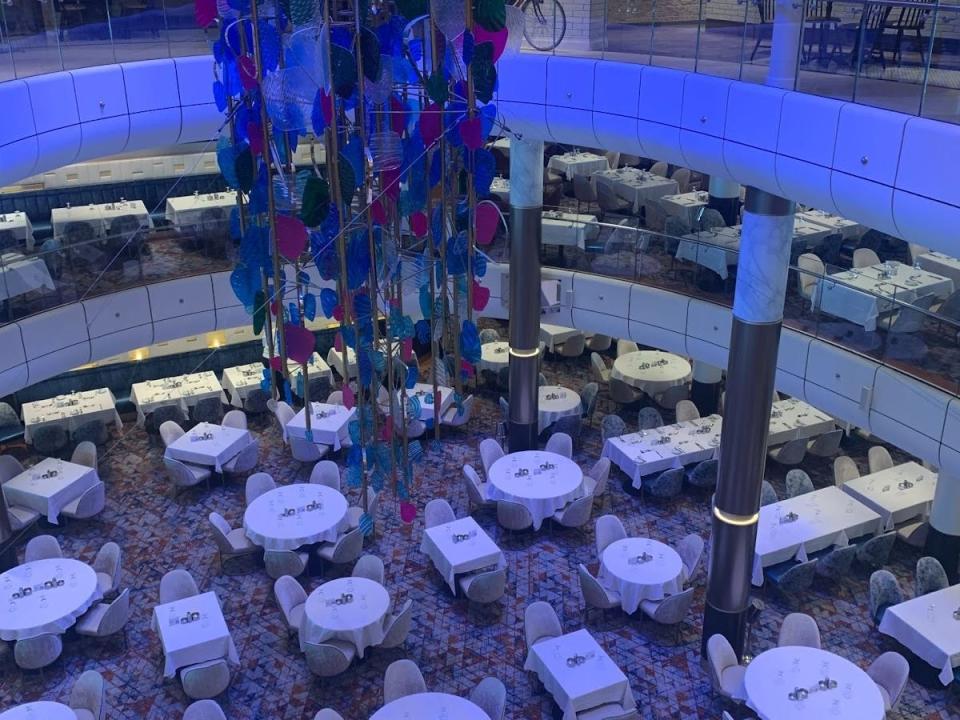 restaurant with white tables on cruise ship