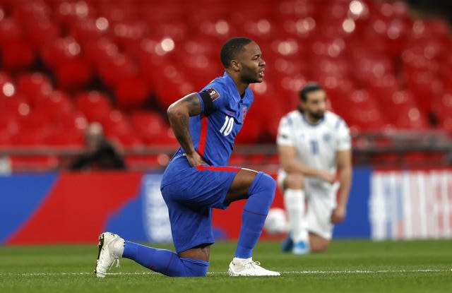 England forward Raheem Sterling takes a knee prior to kick-off