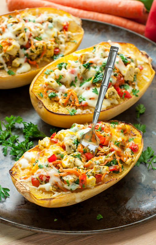 <p>Peas and Crayons</p><p>Cheesy Pesto Chicken and Veggie Stuffed Spaghetti Squash: a mouthful of a title and a mouth full of spaghetti squash deliciousness!</p><p><a href="http://peasandcrayons.com/2015/10/cheesy-pesto-chicken-and-veggie-stuffed-spaghetti-squash.html" rel="nofollow noopener" target="_blank" data-ylk="slk:Get the recipe here!;elm:context_link;itc:0;sec:content-canvas" class="link rapid-noclick-resp"><em><strong>Get the recipe here!</strong></em></a></p>