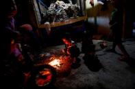 The Wider Image: Cash for trash: Indonesia village banks on waste recycling