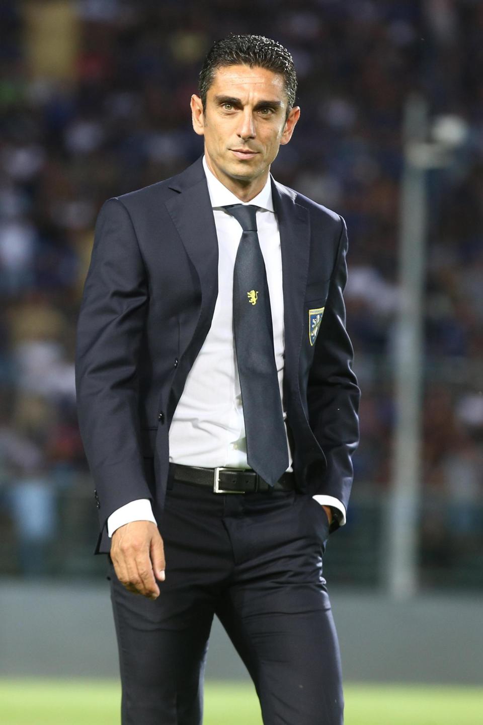 Frosinone coach Moreno Longo enters the pitch prior to the Serie A soccer match between Atalanta and Frosinone Calcio at the Atleti Azzurri d'Italia stadium in Bergamo, Italy, Monday, Aug. 20, 2018. (Paolo Magni/ANSA via AP)