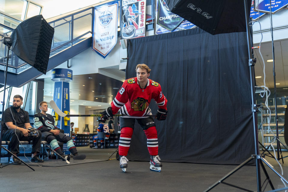 Chicago Blackhawks' Connor Bedard, the number one overall draft pick, gets his portrait taken during the NHL Players Association rookie showcase, Tuesday, Sept. 5, 2023 in Arlington, Va. (AP Photo/Alex Brandon)