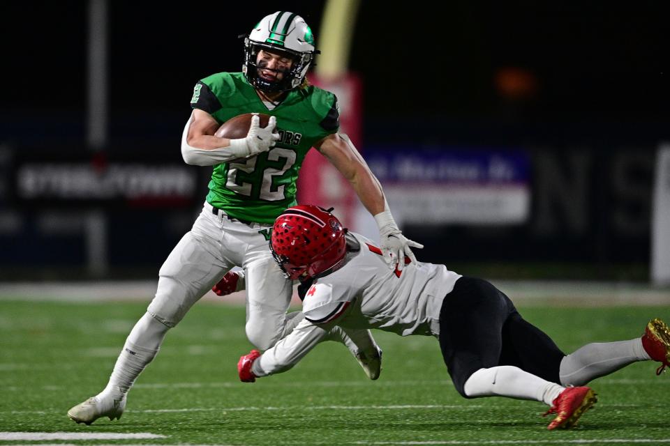 West Branch's Boston Mullinix is tripped up by Jefferson's Grant Hitchcock during the second half of their playoff game, Saturday night at Bo Rein Stadium in Niles.