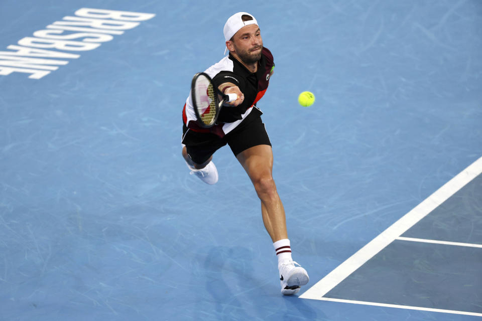 Grigor Dimitrov of Bulgaria plays a shot in his match against Daniel Altmaier of Germany during the Brisbane International tennis tournament in Brisbane, Australia, Thursday, Jan. 4, 2024. (AP Photo/Tertius Pickard)