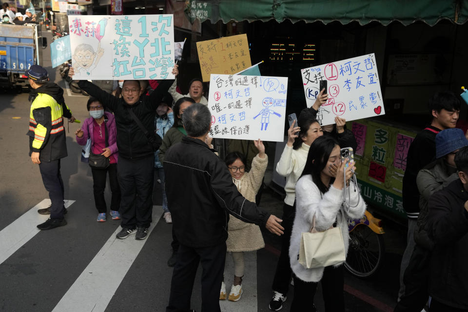 Supporters of Ko Wen-je, Taiwan People's Party (TPP) presidential candidate, cheer as he canvass a neighbourhood in New Taipei City, Taiwan on Wednesday, Jan. 10, 2024. With Taiwan's high-stakes presidential election just days away, the nonconformist candidate has been resonating with the island's youth, seemingly more concerned with the dearth of good jobs and affordable housing than the looming threat from China. (AP Photo/Ng Han Guan)