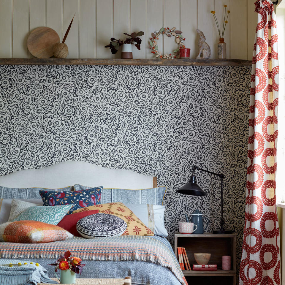 bedroom with wooden table and lamp