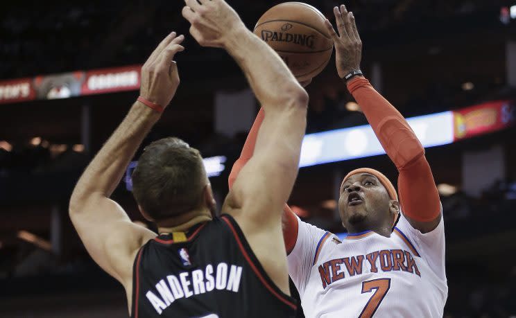 Carmelo Anthony probably wouldn't mind trading places with Ryan Anderson. (AP)