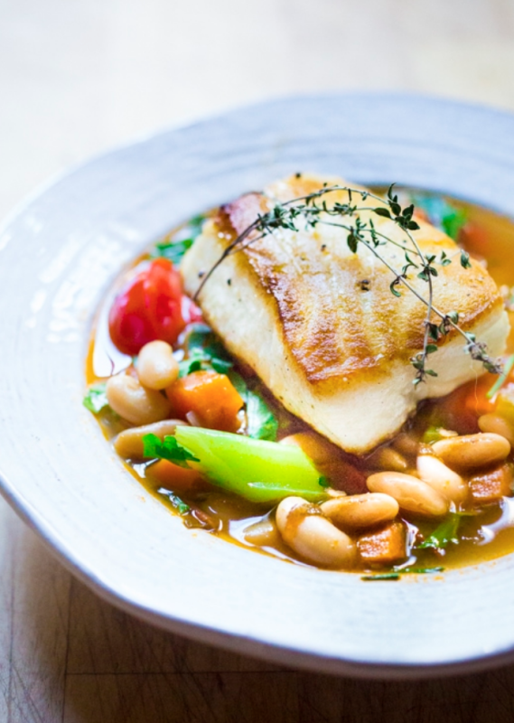 <p>Feasting at Home</p><p>A simple healthy Mediterranean recipe for sea bass served over a fragrant Cannellini bean stew. Hearty and flavorful this easy dinner can be made in 30 minutes!</p><p><strong>Get the recipe: <a href="https://www.feastingathome.com/sea-bass-with-cannellini-bean-stew/" rel="nofollow noopener" target="_blank" data-ylk="slk:Sea Bass with Cannellini Bean Stew;elm:context_link;itc:0;sec:content-canvas" class="link rapid-noclick-resp"><em>Sea Bass with Cannellini Bean Stew</em></a></strong></p>