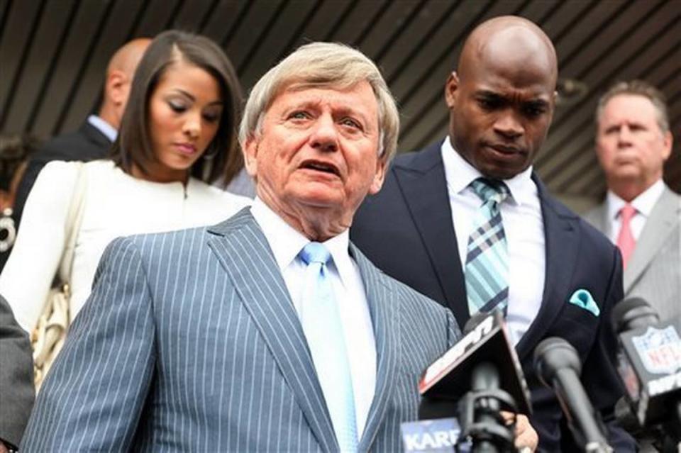 Attorney Rusty Hardin speaks to the media after Minnesota Vikings running back Adrian Peterson, right, pleaded no contest to an assault charge Tuesday, Nov. 4, 2014, in Conroe, Texas. Adrian Peterson avoided jail time on Tuesday in a plea agreement reached with prosecutors to resolve his child abuse case. (AP Photo/ The Courier, Michael Minasi)