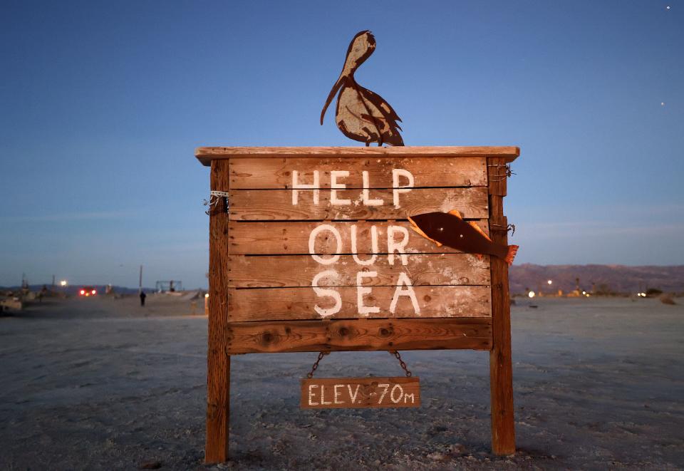A sign by artist Keith Jones is one of many art installations on display on the shores of the Salton Sea in Bombay Beach, Calif., on Friday, Dec. 15, 2023. | Kristin Murphy, Deseret News
