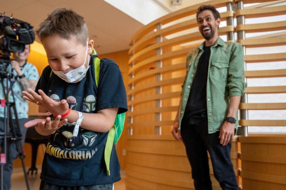 Children’s Mercy patient Jaxson Kress, 8, stared at his hand in disbelief after magician and Big Slick guest Blake Vogt performed a magic trick on him at the hospital Thursday.