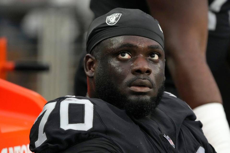FILE - Las Vegas Raiders offensive tackle Alex Leatherwood looks up during the first half of the team's NFL preseason football game against the Minnesota Vikings on Aug. 14, 2022, in Las Vegas. The Raiders waived Leatherwood on Tuesday, Aug. 30, the third of the club's three first-round draft picks in 2020-21 to get dumped before the end of their second season. (AP Photo/Rick Scuteri, File)