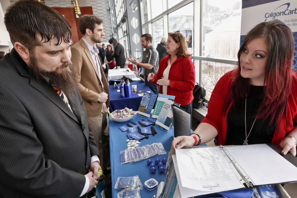 FILE - In this March 7, 2019, file photo visitors to the Pittsburgh veterans job fair meet with recruiters at Heinz Field in Pittsburgh. On Wednesday, June 5, payroll processor ADP reports how many jobs private employers added in May. (AP Photo/Keith Srakocic, File)