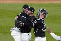 Chicago White Sox starting pitcher Carlos Rodon, center, celebrates his no hitter against the Cleveland Indians with his teammates in a baseball game, Wednesday, April, 14, 2021, in Chicago. (AP Photo/David Banks)