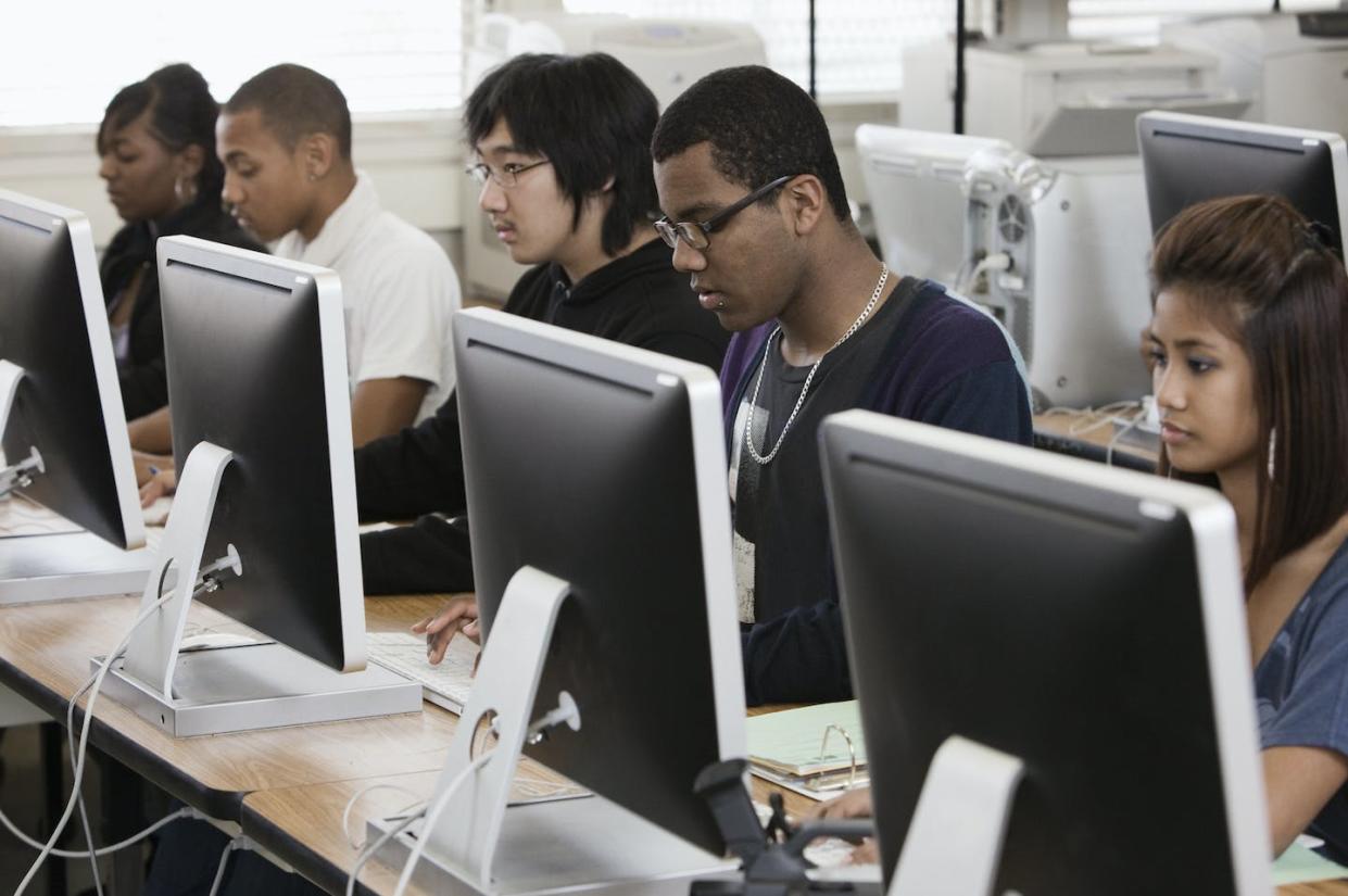 Schools can help students see themselves working in computer science. <a href="https://www.gettyimages.com/detail/photo/students-working-in-computer-lab-royalty-free-image/102754951?adppopup=true" rel="nofollow noopener" target="_blank" data-ylk="slk:Hill Street Studios/Getty Images;elm:context_link;itc:0;sec:content-canvas" class="link ">Hill Street Studios/Getty Images</a>