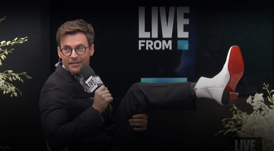 "E! Countdown to the Red Carpet" host Brad Goreski shows off his shoes