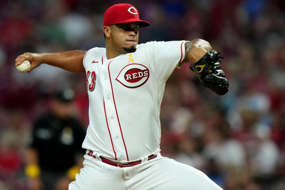 Cincinnati Reds starting pitcher Fernando Cruz (63) delivers a pitch during the sixth inning of a baseball game against the Colorado Rockies, Friday, Sept. 2, 2022, at Great American Ball Park in Cincinnati. The appearance marked his major-league debut.