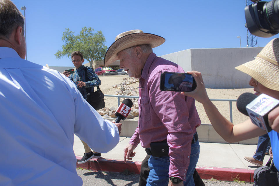 George Alan Kelly, center, is followed by reporters as he exits the Santa Cruz County Courthouse on Monday, April 29, 2024, in Nogales, Arizona. Kelly's trial in the fatal shooting of a Mexican man on his property ended last week with a deadlocked jury and prosecutors said Monday they will not retry him. (Angela Gervasi/Nogales International via AP)