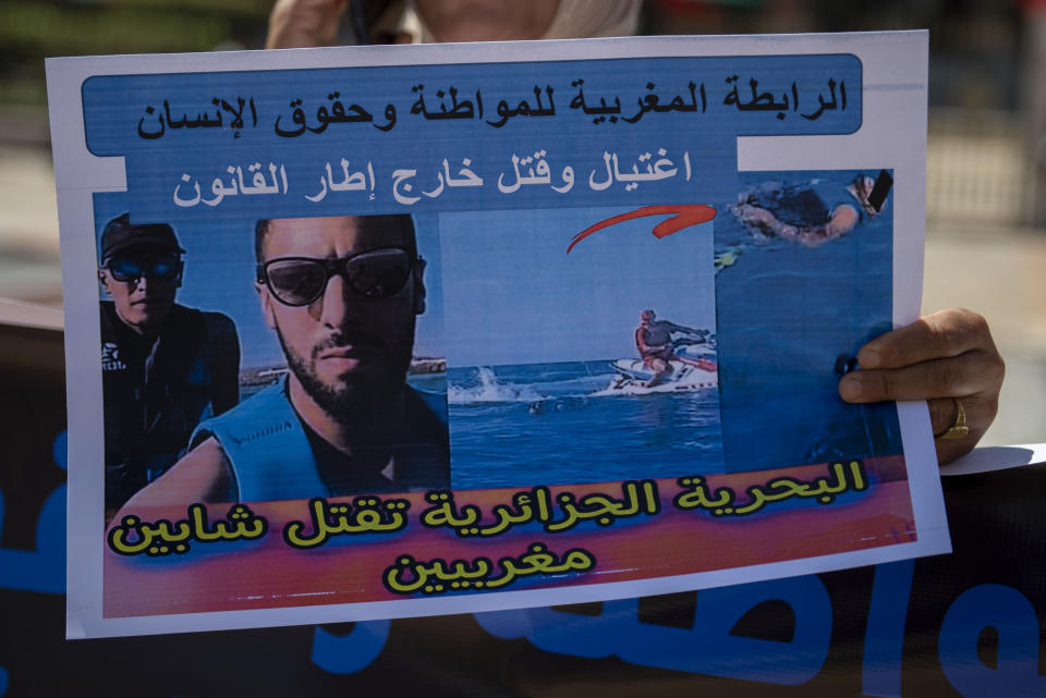 People hold banners and gather to stage a protest in Rabat, Morocco, Monday, Sept. 4, 2023, to condemn the killing of two men by Algerian forces after they strayed across Morocco's maritime border with Algeria on water scooters. (AP Photo)