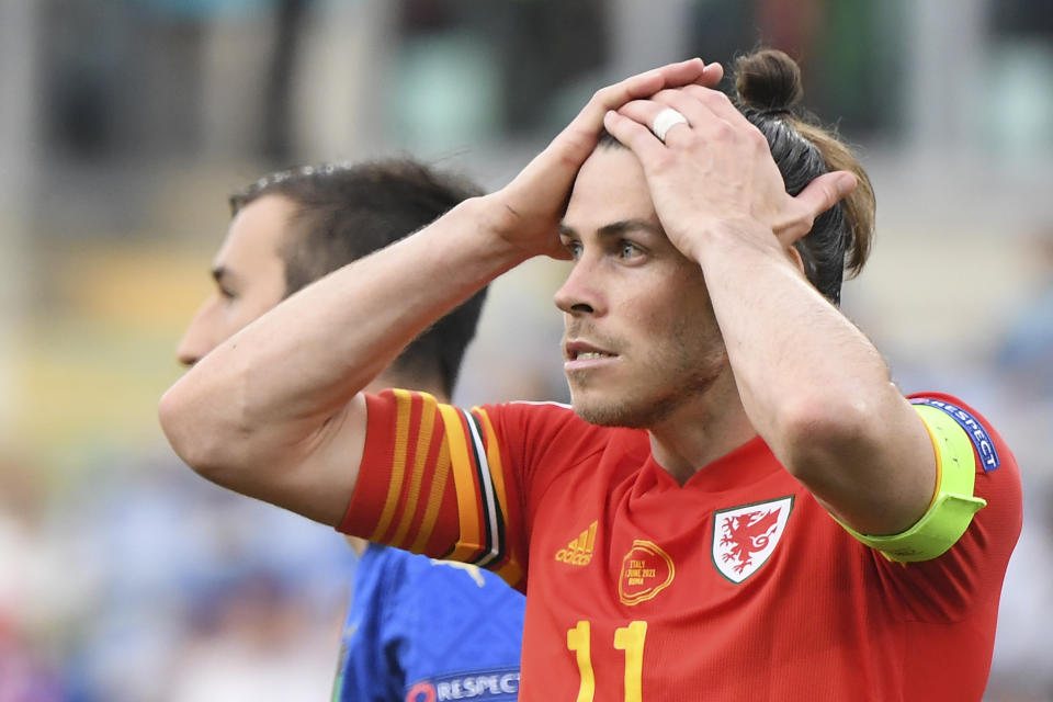 Wales' Gareth Bale reacts after missing a chance during the Euro 2020 soccer championship group A match between Italy and Wales at the Stadio Olimpico stadium in Rome, Sunday, June 20, 2021. (Alberto Lingria/Pool via AP)